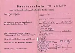 Pink slip of paper with the heading "Passierschein III zum vorübergehenden Aufenthalt in der Sperrzone"