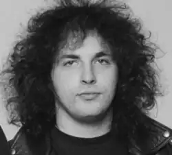 b/w portrait of caucasian male with big hair, early 20s