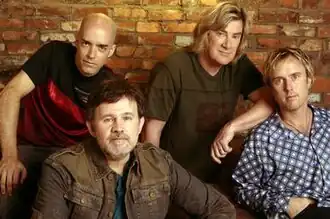 Petra lineup in 2003. (From left) Greg Bailey, Bob Hartman, John Schlitt, and Paul Simmons.