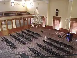 A view from the fourth floor of the Arizona State Capitol Museum looking down from the gallery into the original Senate chamber.
