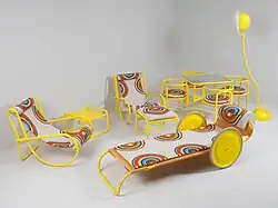 An outdoor furniture set in orange, red and white circular geometric design