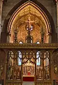 The screen designed by Bodley (1906), who also designed the organ case and reredos
