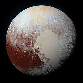A multispectral Visual Imaging Camera image of Pluto in enhanced color to bring out differences in surface composition