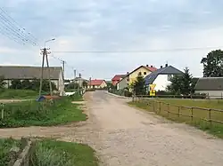 Houses by the unpaved road in Nowe Chlebiotki