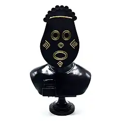 Sculpture made of bronze depicting a head and shoulders with an African mask.