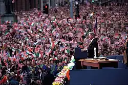 Bill Clinton addressing the crowd from the front of the building in 1995