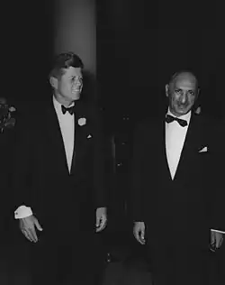 A black and white photograph from 1963 showing Mohammed Zahir Shah, King of Afghanistan, and John F. Kennedy, President of the United States.