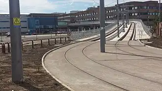 The eastern ramp and tram stop seen from street level