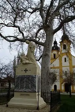 A monument in Rábapordány along with a church.
