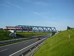 Railway bridge over D6 between Jeneč and Hostouň.