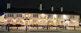 long two-storey white building