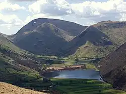 Red Screes and Middle Dodd seen beyond Brothers Water from the Patterdale Valley. On the right is High Hartsop Dodd.