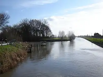 The Ypres Canal flows into the Yser at the left. The view is from the bridge looking southwest. The wedge of land between the streams is the site of the citadel.