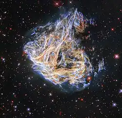 Revisiting a Celestial Fireworks Display Shreds, from the Wide Field Planetary Camera 2. The delicate sheets and intricate filaments are debris from the cataclysmic death of a massive star that once lived in the LMC.[60]