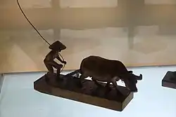 Carving depicting a Filipino farmer and a carabao