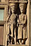 Right pair of caryatids, one in armour and tunic with fleur de lys, representing France (Joan of Arc), first floor, bay five, Princes Street façade