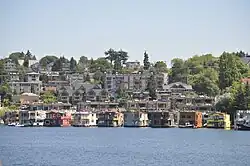 Along the waterline, the two-story floating homes of Roanoke Reef, seen here from Gas Works Park, have replaced the more modest structures in the previous image.