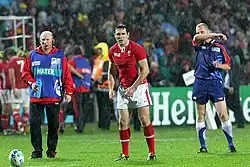 The Welsh rugby player Stephen Jones stands in the rain before attempting a kick at goal in the Wales versus Fiji match of the 2011 Rugby World Cup.