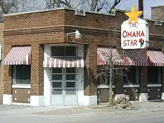 Brick Building with Omaha Star sign.