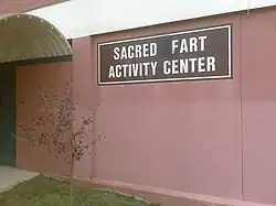 An example of grafitti where a sign has been edited to spell the word "fart". Grafitti and farting are widely considered to be rude, but this rudeness is often seen as having comic potential.