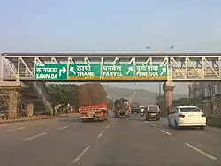 Exit sign for Thane–Belapur Road on Sion Panvel Highway near Sanpada.