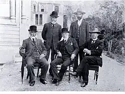 Photo of five men