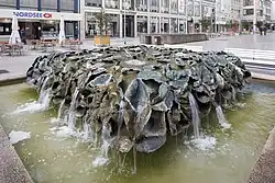 The Blätterbrunnen of 1976 by Emil Cimiotti, as seen 2014 in the city center of Hanover, Germany. A lost-wax method was used for the bronze leaves.