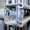 Spring-loaded nut placed inside the channel allows connections with bolts