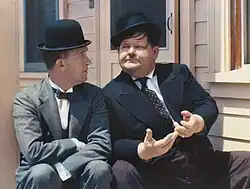 Laurel and Hardy, 1938. Stan Laurel took his standard comic devices from the British music hall: the bowler hat, the deep comic gravity, and nonsensical understatement.[26]