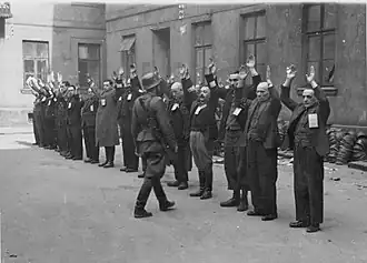 NARA copy #4, IPN copy #4 The Jewish department heads of the armament firm Brauer Herman Brauer helm repair shop at Nalewki 28–38