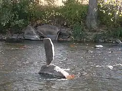found art, granite, in running water at Sylvan Dale Guest Ranch