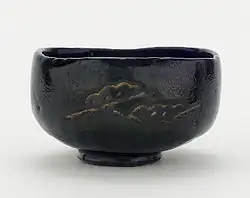 Tea bowl with designs of pine boughs and interlocking circles, unknown raku ware workshop, Kyoto, Edo period, 18th–19th century