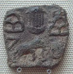 Pandyan Kingdom coin depicting a temple between hill symbols and elephant, Pandyas, Sri Lanka, 1st century CE.
