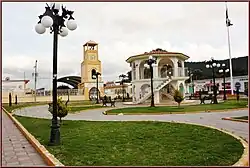 Circular temple with multiple arches, and a staircase leading to the second floor