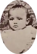 Oval photograph of young baby, 1885.