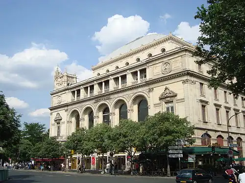 The Théâtre de la Ville, one of two matching theaters, designed by Gabriel Davioud, which Haussmann had constructed at the Place du Châtelet, the meeting point of his north–south and east–west boulevards.