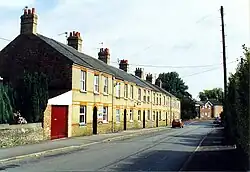 Row of terraced houses along a residential road