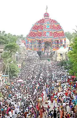 chariot festival with people drawing a chariot with ropes