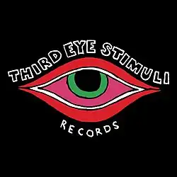 A green eye outlined in red with text wrapped around