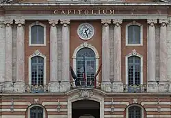 Three flags tied up in front of the Capitole