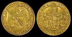 A golden coin depicting an armored middle-aged man on one side, and a coat-of-arms on the other side