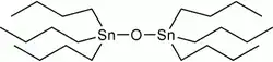 Tributyltin oxide, a colorless to pale yellow liquid used in wood preservation