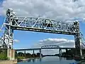 Located only about 400 m (1,312 ft) south of the St-Laurent Railway Bridge, on the same line, is a pair of vertical-lift bridges to carry the rail line over the Saint Lawrence Seaway