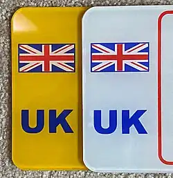 The default post-September 2021 UK National Identifier plate[5] (text can also be black)