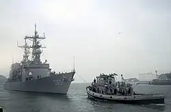 Kittanning tows USS Cushing (DD-985)