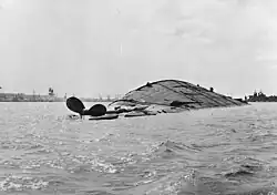 USS Oklahoma overturned, 7 December 1941.