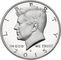 Obverse of a coin with Kennedy's left profile, underneath it the motto "IN GOD WE TRUST" and encircled by the words "LIBERTY" and "2015", and the mint mark "S"