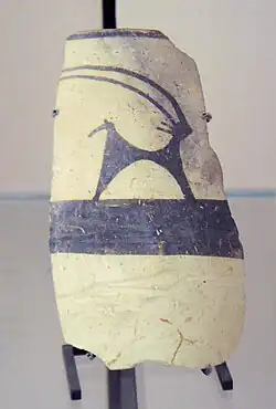 Fragment of pottery with a painting of an Ibex; 4700-4200 BC; painted ceramic; from Girsu; Louvre[21]