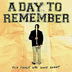The backside of a person on a crumbled piece of paper holding a bat. Underneath, higlighted, reads "For Those Who Have Heart" in black. "A Day To Remember" is above in black.