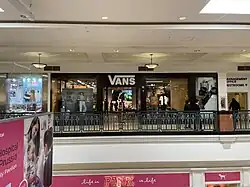 Exterior view of a Vans retail store in a shopping mall